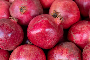 Fototapeta na wymiar New fresh pomegranates for sale at the city farmers market