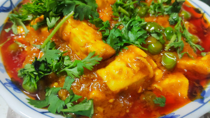 Paneer butter masala in a bowl
