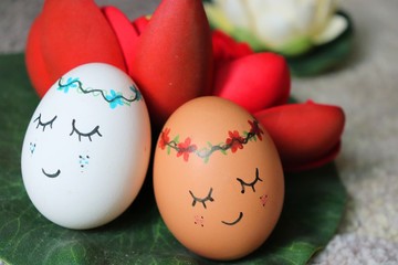 Fototapeta na wymiar Funny and cute eggs faces for Easter. colorful Easter eggs