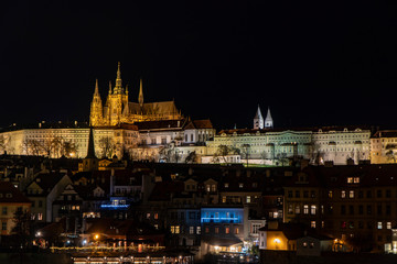 Fototapeta na wymiar PRAGUE, CZECH REPUBLIC - DECEMBER 2019: A view of the Prague Castle at Night Time