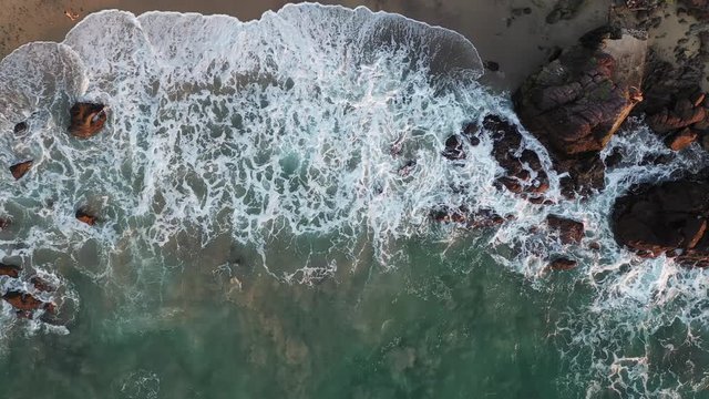Aerial overhead shot of the Puerto Vallarta beach in Mexico with big waves.