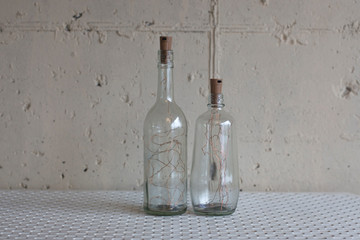Wired lamp in glass bottle