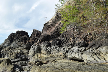 seawaves pounding tropical island rocks in outlying shores of Hugom, San Juan, Batangas, Philippines