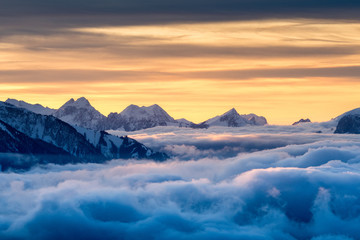 sea of fog in front of the Swiss Alps at a winter sunset