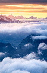 sea of fog in front of the Swiss Alps at a winter sunset