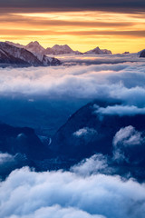 sea of fog in front of the Swiss Alps at a winter sunset