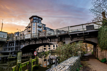 Carrow Road Bridge crossing over the River Wensum in the city of Norwich captured at dusk