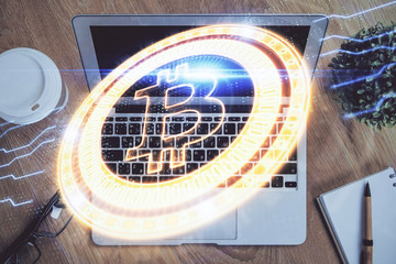 Multi exposure of blockchain theme hologram and table with computer background. Concept of bitcoin...