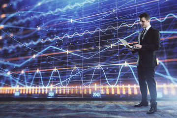 Obraz premium Businessman and forex graph hologram. Double exposure. Concept of financial education and analysis