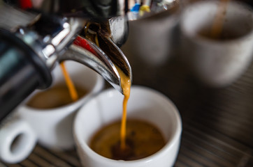 Barista making a cup of coffee soft focus image  © tewpai
