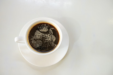 Barista making a cup of coffee soft focus image 