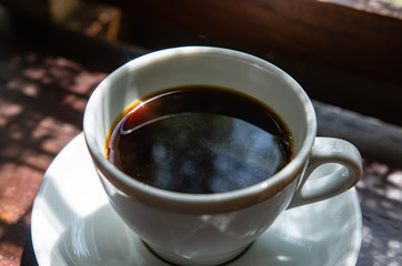 Barista making a cup of coffee soft focus image 