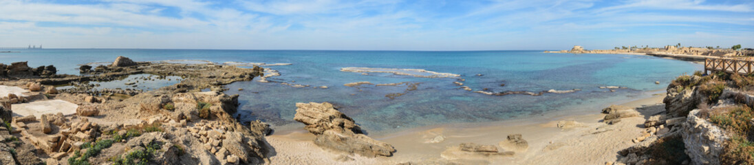 Fototapeta na wymiar Mediterranean Sea and the remains of the port in Caesarea.