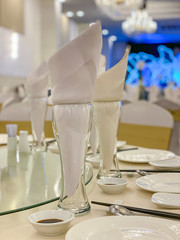 Closeup photo of glasses and tableware on banquet table