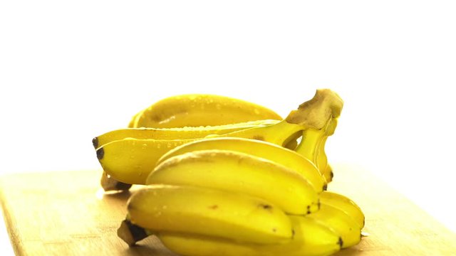 Bananas. A bunch of bananas rotates, an interesting foreshortening, an advertising shot.