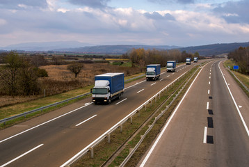 Fototapeta na wymiar Columns of trucks on the road