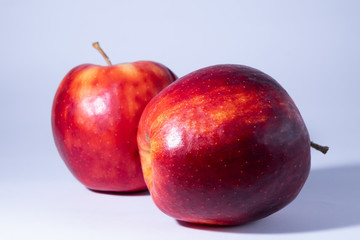 Fresh and delicious apple, red ripe apples. Isolated on color background.
