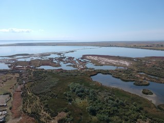 Aerial overhead photo from a drone over a swamp on the delta of Axios river in Thessaloniki/Greece ...
