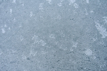 Winter background, frost on the metal. Matte texture.