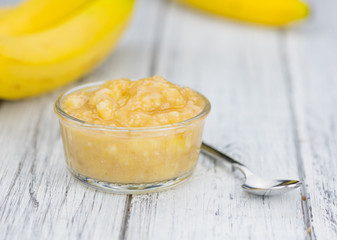 Banana Puree on wooden background