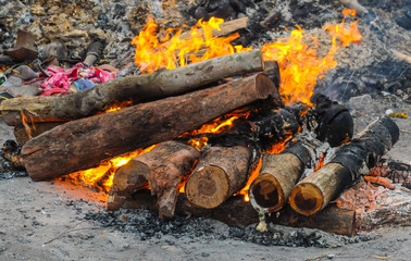 A funeral pyre burning intensely at Swargadwar crematorium,Puri,Odisha state,India.