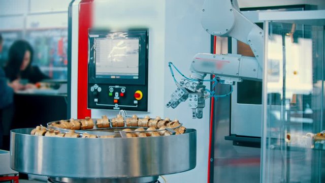 An industrial machine working with details