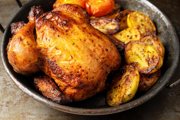 close up of rustic golden roasted whole chicken