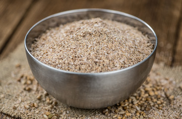 Some fresh Wheat Bran (selective focus; close-up shot)