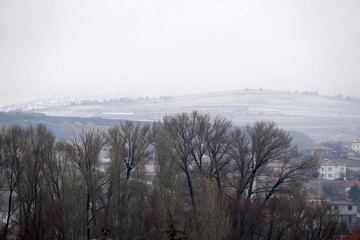 Fumes from a winter city and chimney, stove smoke from the chimneys of houses,