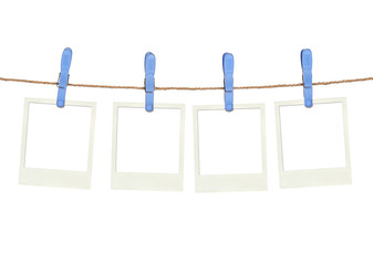 Four plastic clothespins and instant frame on rope