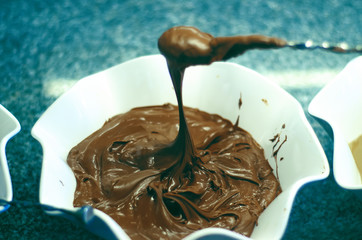 Chocolate paste in bowl on table at buffet, close up