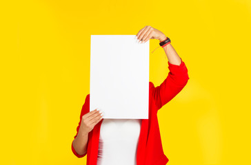 woman holding a paper on face, instead of her head