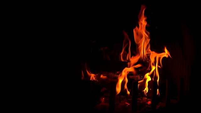 Super slow motion of burning Fire In The Fireplace. A looping clip of a fireplace
