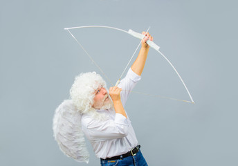 Male angel Cupid with bow and arrows of love. Saint Valentines Day celebration. Valentines cupid...
