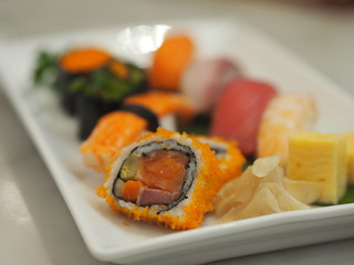 Set Sushi Japanese rice ball topped with salad dressing, salmon, tuna, Seaweed salad and Shrimp eggs