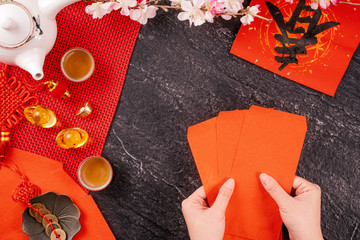 Design concept of Chinese lunar January new year - Woman holding, giving red envelopes (ang pow,...