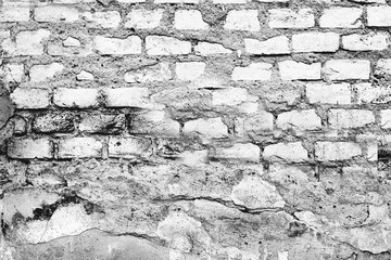 Texture of a brick wall with cracks and scratches which can be used as a background