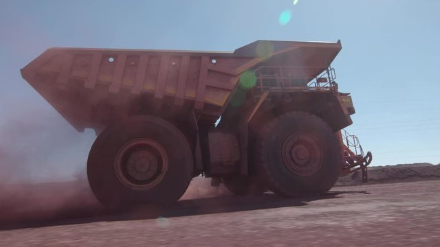 huge mining truck is driving fast in Africa