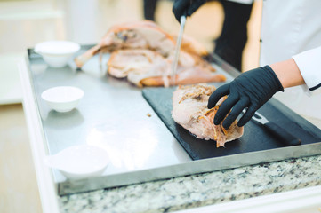 chef cutting meat