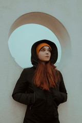 Woman with jacket and hat in cold winter day 