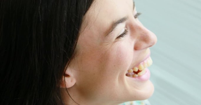 happy woman in her office typing