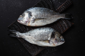 Fresh dorado fish with ingredients