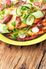 Bread cake with meat and cucumber