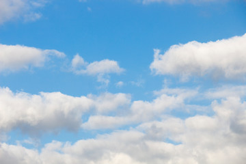 Bright blue sky with white clouds for background or wallpapers