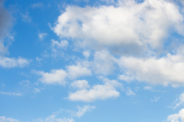 Bright blue sky with white clouds for background or wallpapers