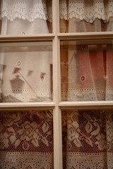 French window with traditional lace curtain