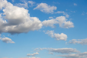 Bright blue sky with white clouds for background or wallpapers