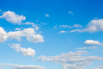 Bright blue sky with white clouds for background or wallpapers