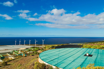 Farm landscape with wind turbines