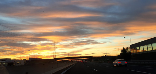 Fototapeta na wymiar Sunset road in italian highway